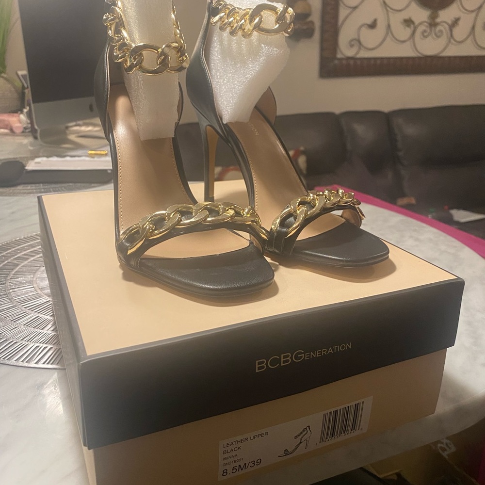 Brand New BCBG black heels with gold ankle chain. Box is included.